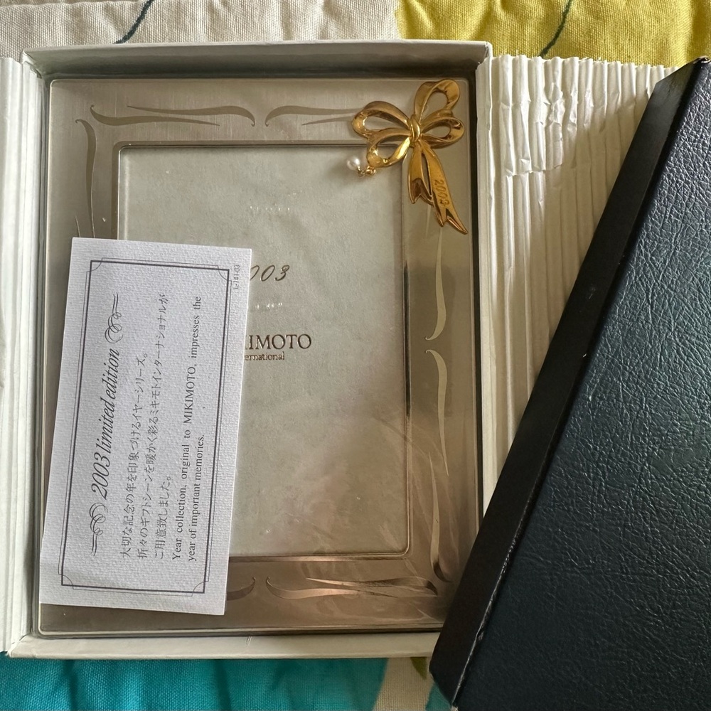 rare 2003 mikimoto stainless steel and gold toned picture frame with Akoya pearl